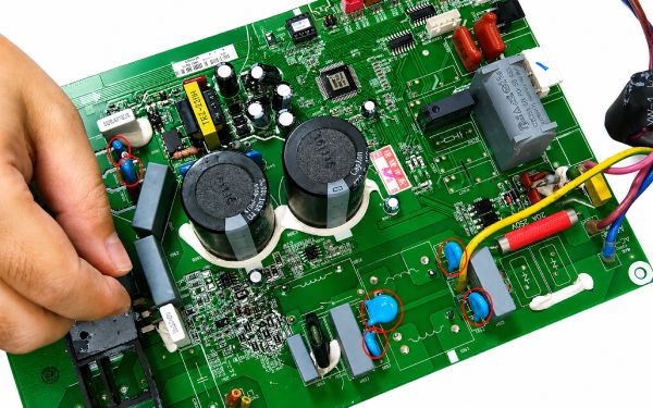 Close-up of surface-mount MLCC ceramic capacitors on a smartphone printed circuit board